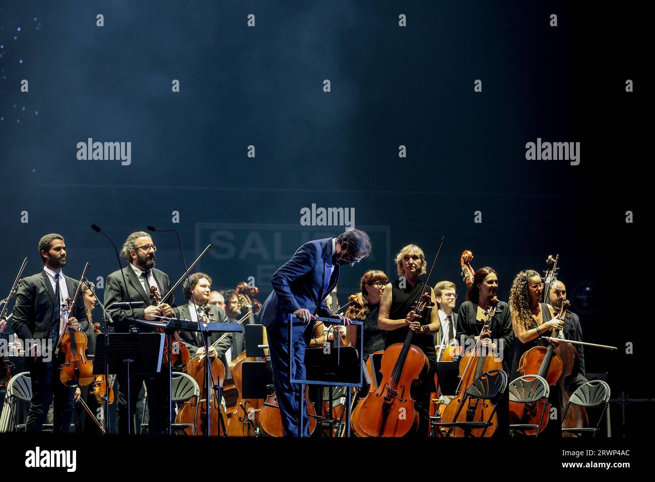The symphony orchestra accompanying singer Andrea Bocelli during a  performance at the WiZink Center, on September 20, 2023, in Madrid (Spain).  Andrea Bocelli is an Italian singer, musician, writer and music producer.