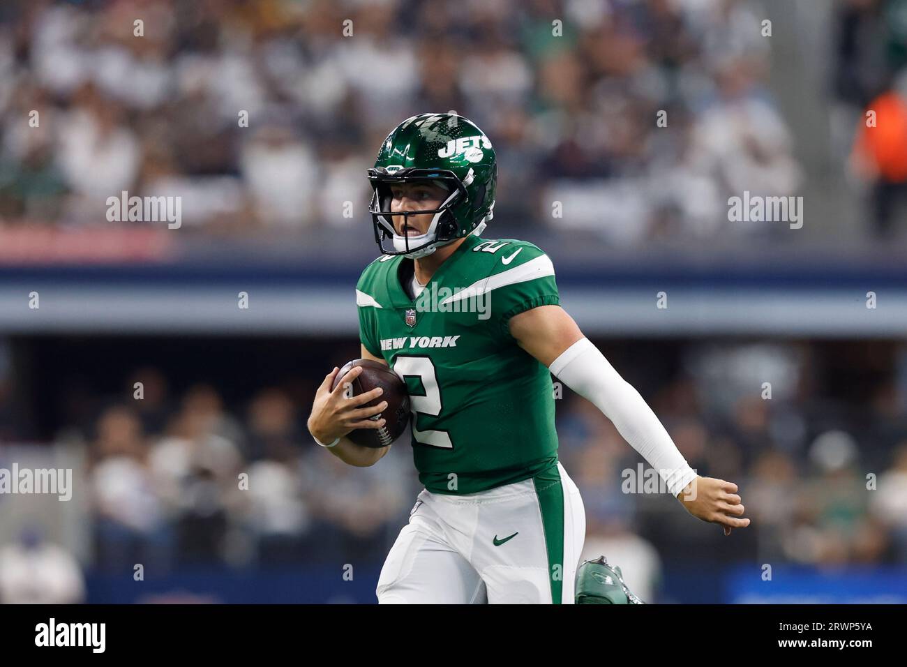 New York Jets quarterback Zach Wilson (2) carries the ball during an