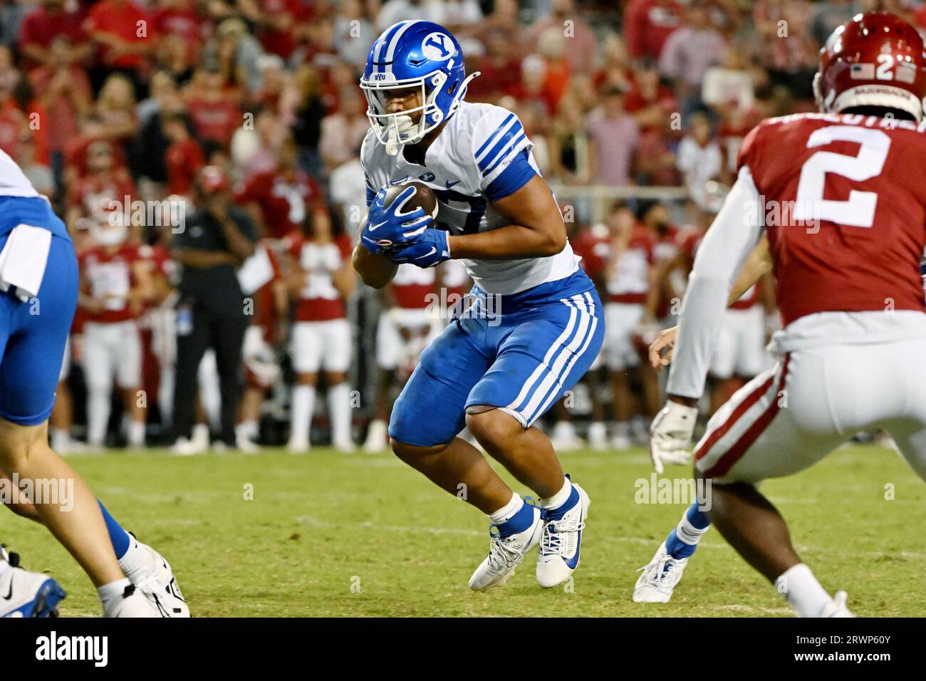 BYU running back LJ Martin (27) runs the ball against Arkansas during an NCAA college football