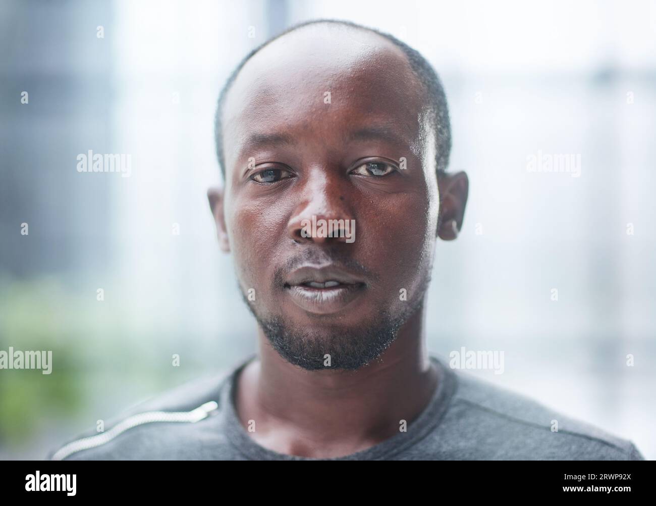 African young man standing hi-res stock photography and images - Alamy