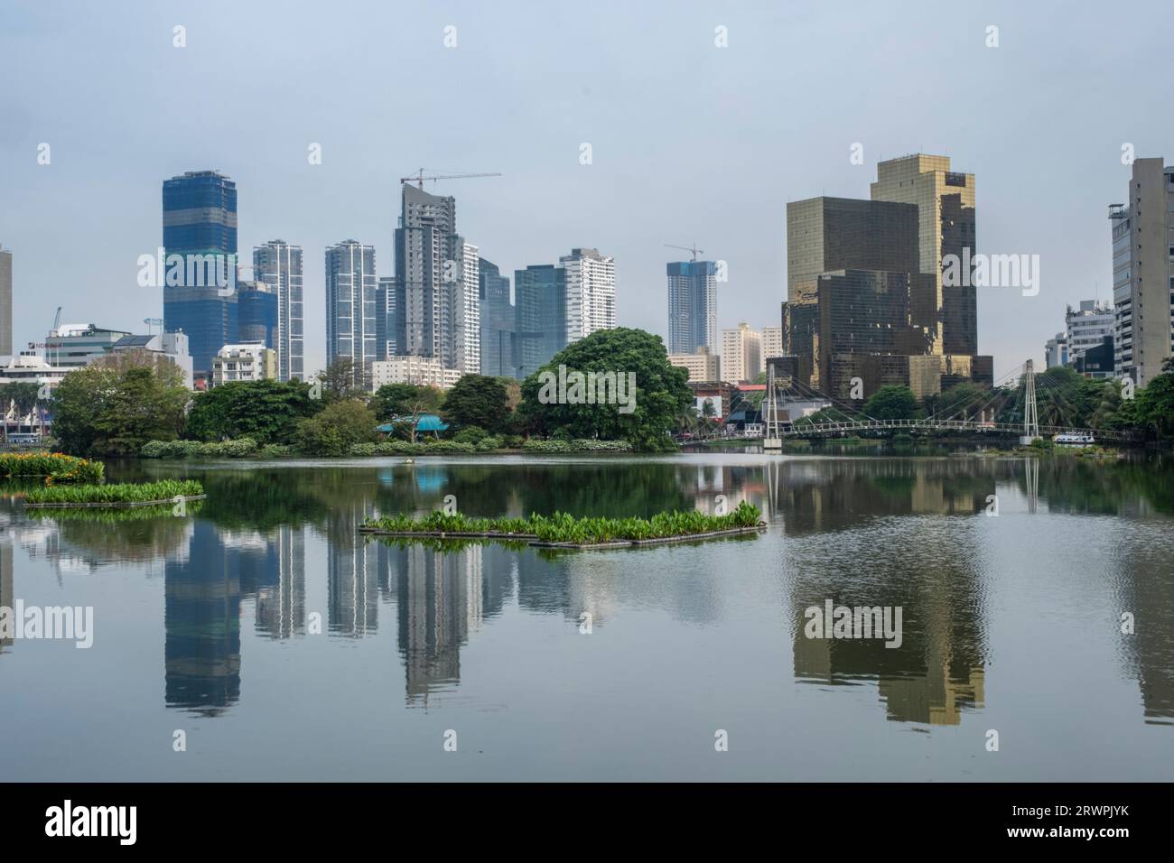 Asia, Sri Lanka, Colombo, City Skyline. Beira lake & Gangaramaya Park. Urban cityscape of Central Business District (CBD) Stock Photo