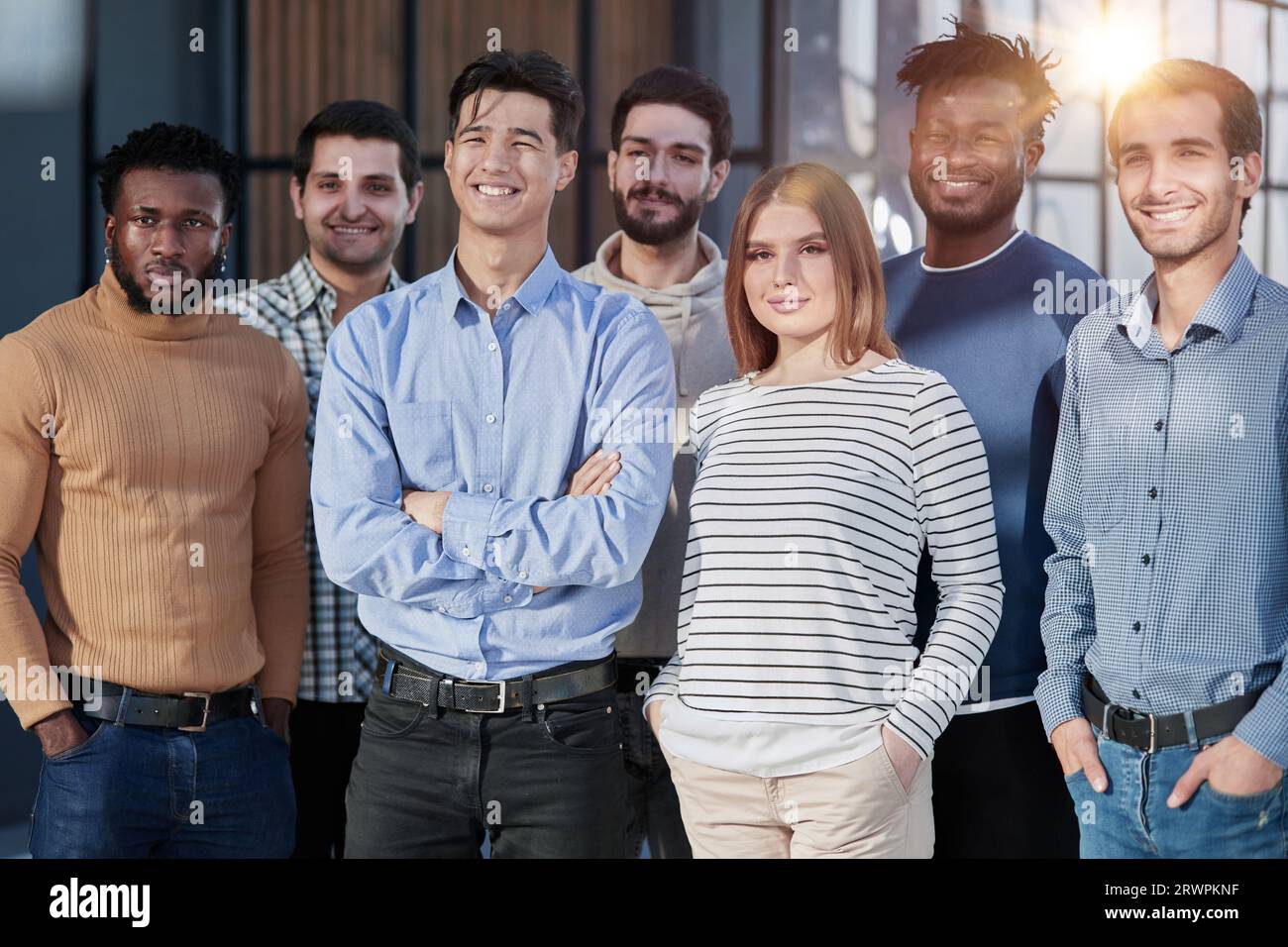 Successful business team smiling while standing in the office Stock ...