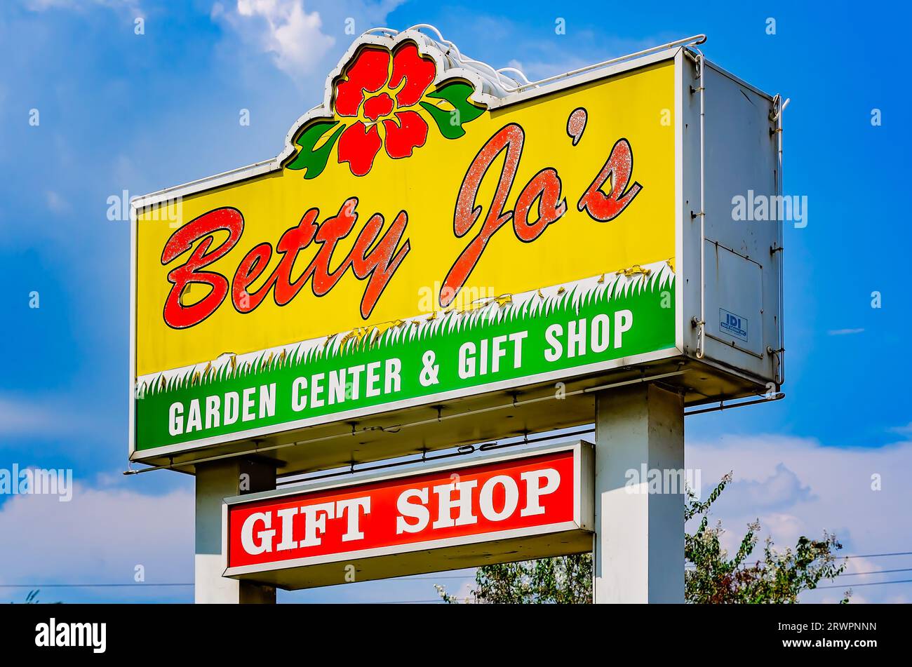 Betty Jo’s Garden Center sign features a flower, Aug. 26, 2023, in Theodore, Alabama. The nursery and gift shop was founded in 1989. Stock Photo