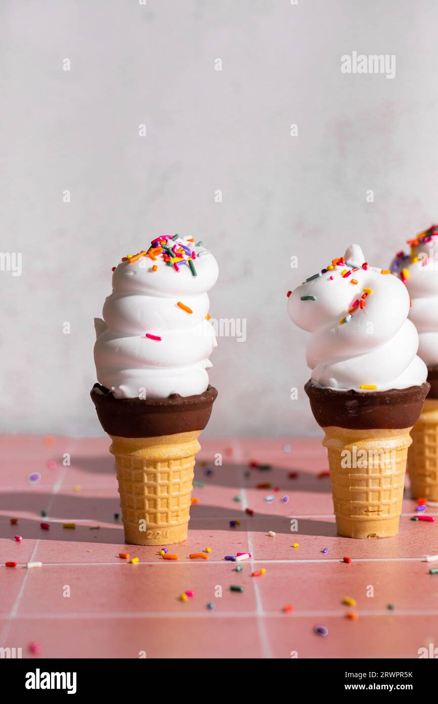 Vanilla soft serve ice cream in a cone with sprinkles Stock Photo - Alamy
