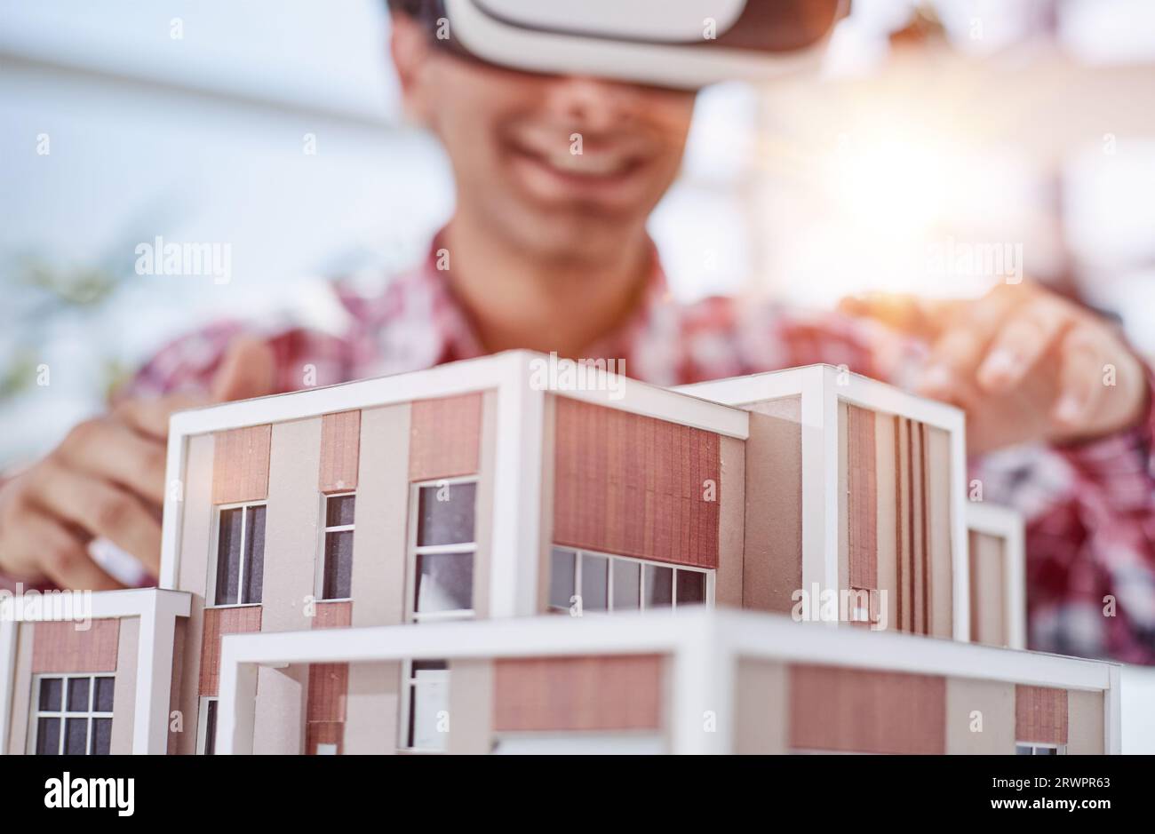 Virtual reality futuristic design technology. Architect or design engineer in VR headset for BIM technology designing a 3D model Stock Photo