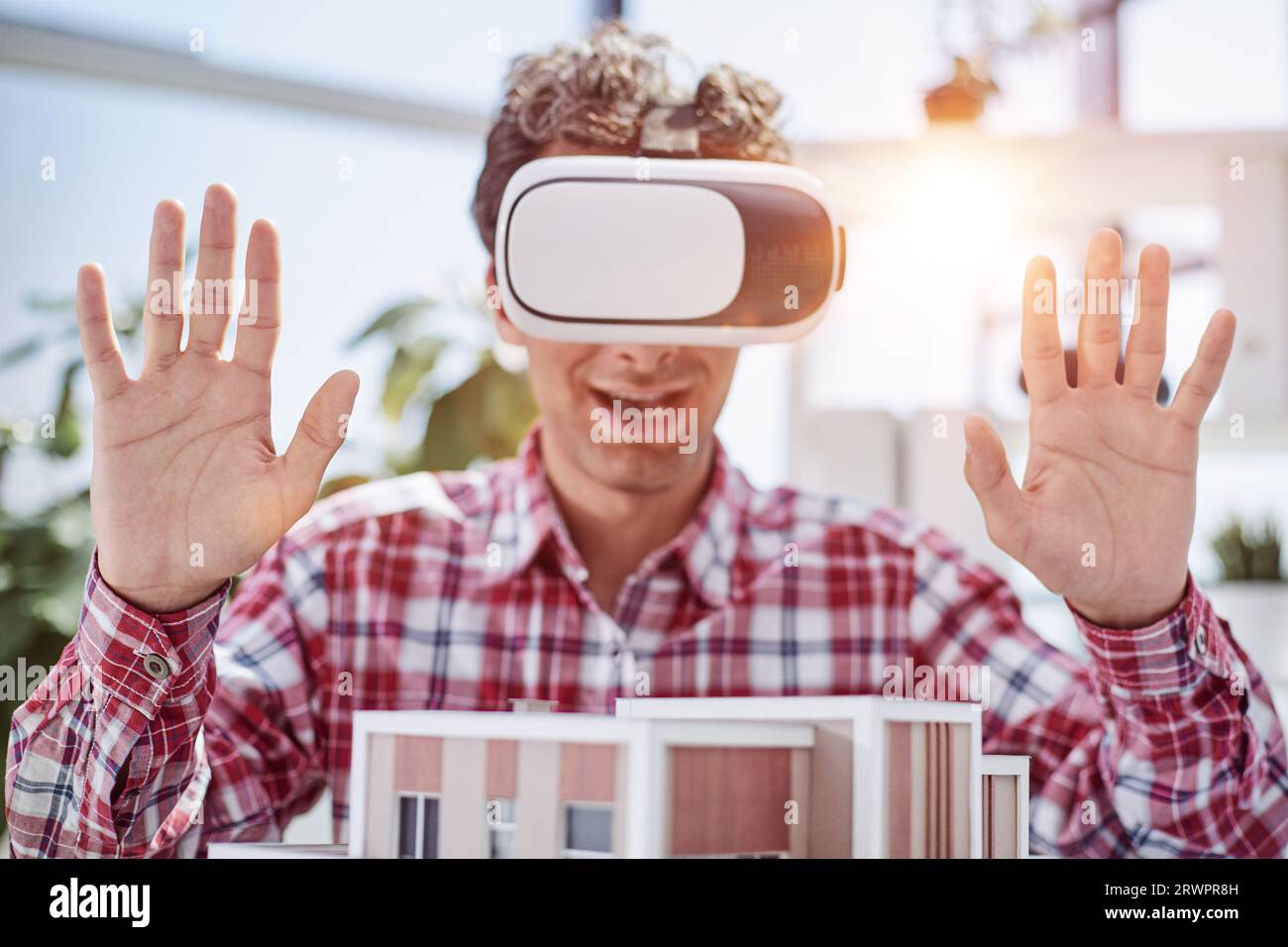 Virtual reality futuristic design technology. Architect or design engineer in VR headset for BIM technology designing a 3D model Stock Photo