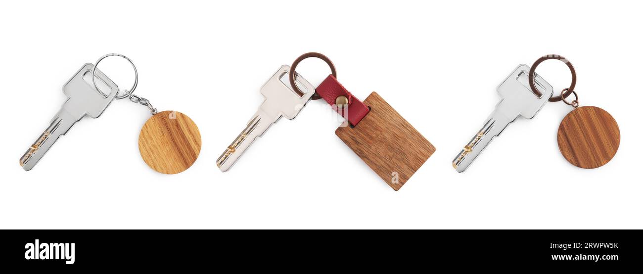 Set of keys with wooden key chains isolated on white Stock Photo