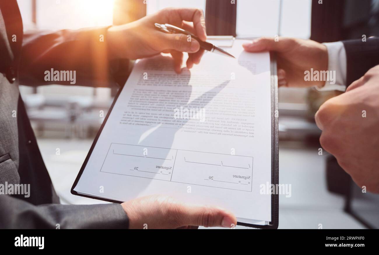Two Businessmen Having Informal Meeting In Modern Office Stock Photo
