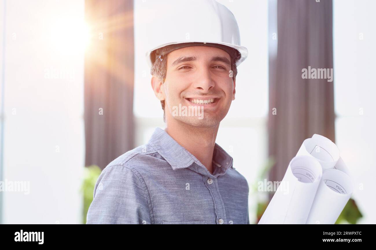 Portrait of an engineer in a hard hat posing for the camera Stock Photo