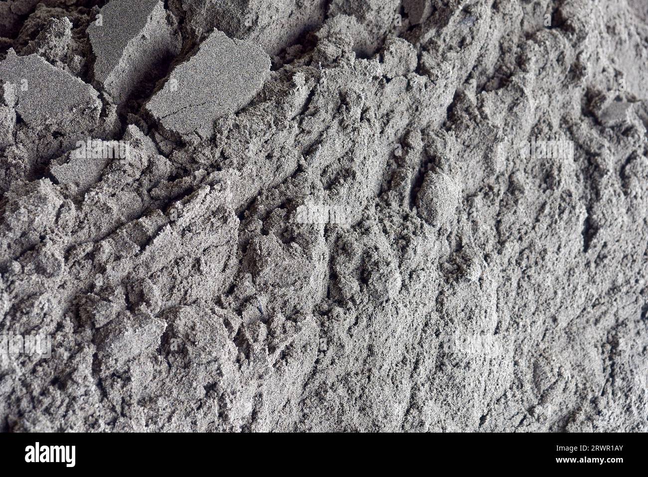 Gray sand close-up. Sand texture in full screen. Abstract background. Stock Photo