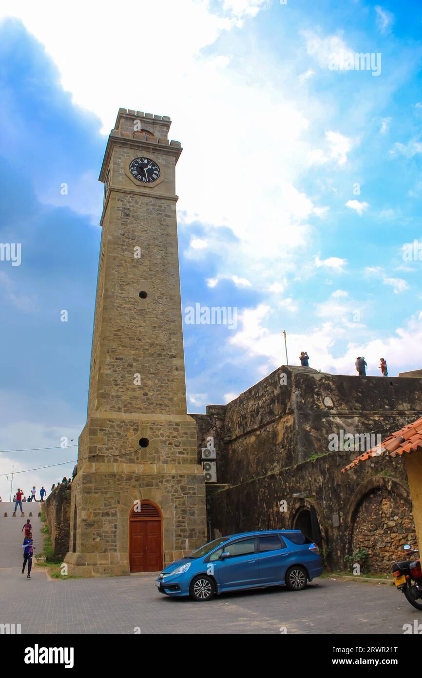 Close up on the old clock tower in Galle, Sri Lanka. Sunset sky, copy