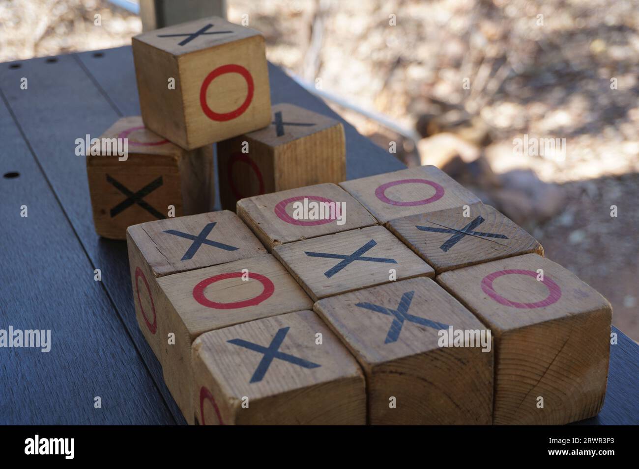 close up of noughts and crosses or tic-tac-toe wooden block kids game Stock Photo