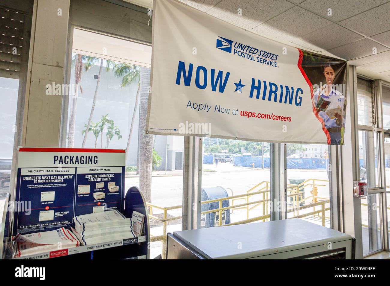 Miami Beach Florida,United States Post Office USPO,inside interior,sign information,promoting promotion,advertising banner,help wanted apply now hirin Stock Photo