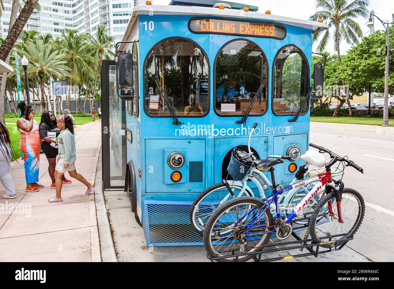 Miami Beach Florida,free trolley Collins Express,bicycle carrier,public transportation,woman women lady female,adult,friends,Black Blacks minorities A Stock Photo