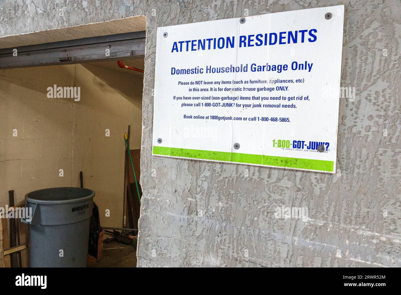 Miami Beach Florida,condominium building sign,domestic household garbage only,trash bin,sign information Stock Photo