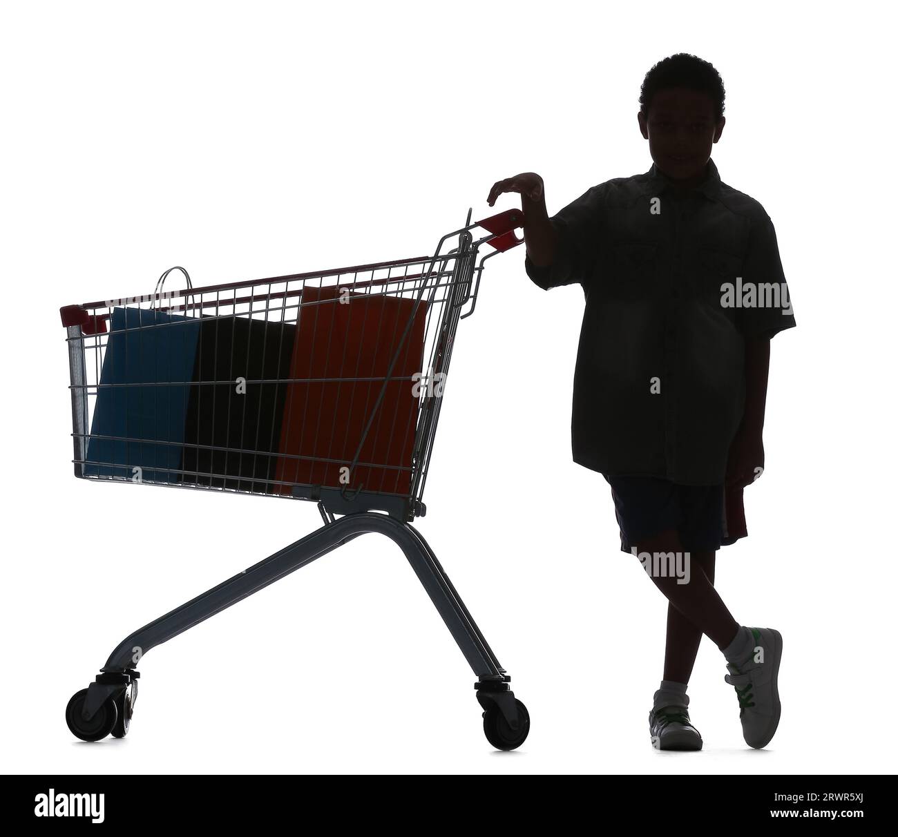 Silhouette of little boy with shopping cart on white background Stock Photo