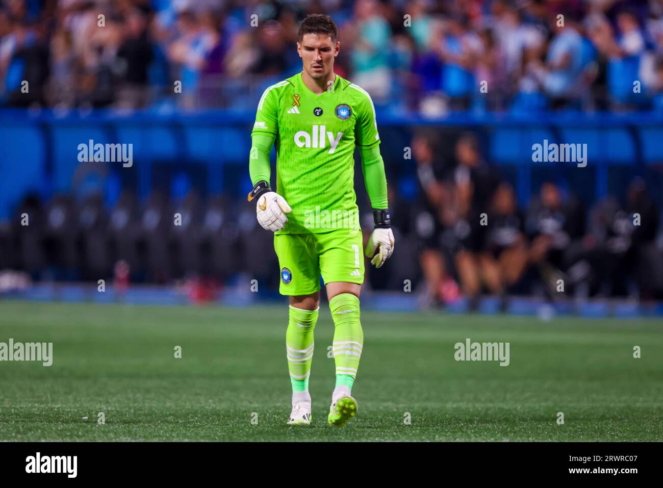 CHARLOTTE, NC - SEPTEMBER 20: Kristijan Kahlina #1 of Charlotte FC walks  back to the goal during a soccer match against the Philadelphia Union at  Bank of America Stadium in Charlotte, North