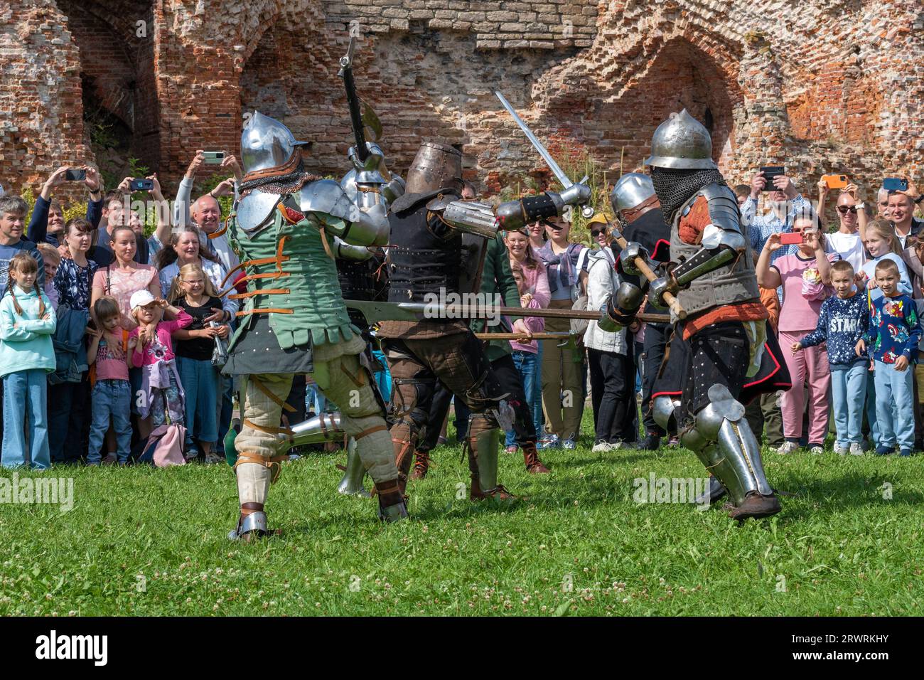 SHLISSELBURG, RUSSIA - JULY 29, 2023: Reconstruction of the battle of medieval heavily armed foot soldiers. Historical festival 'Epic Island-2023'. Or Stock Photo