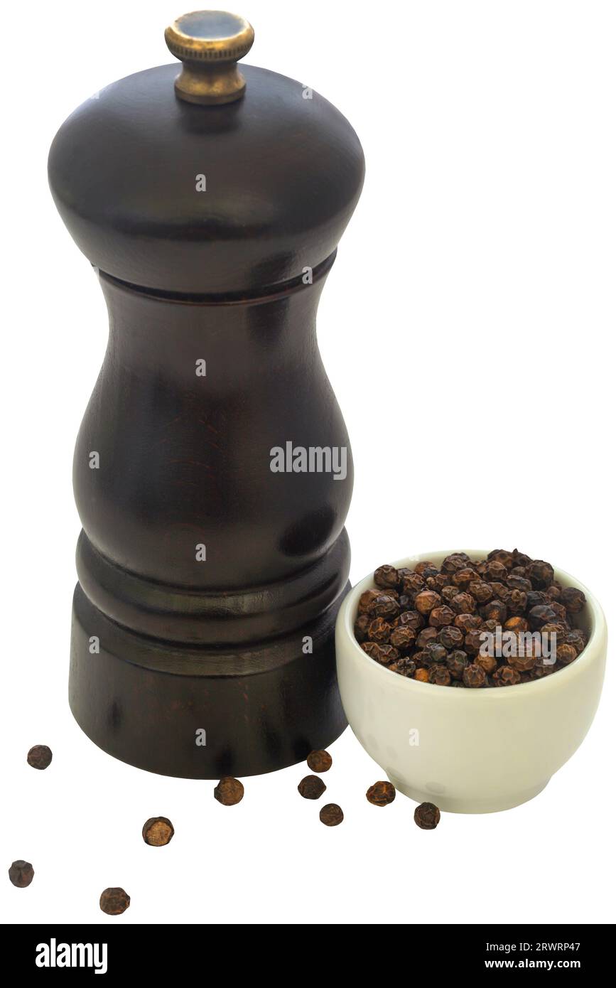 Wooden pepper mill with black pepper closeup Stock Photo