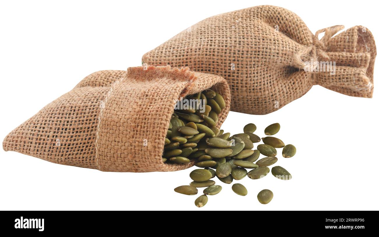 Peeled organic pumpkin seeds in a jute sack Stock Photo