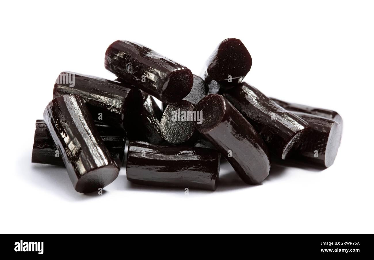 Pieces of black liquorice on white Stock Photo