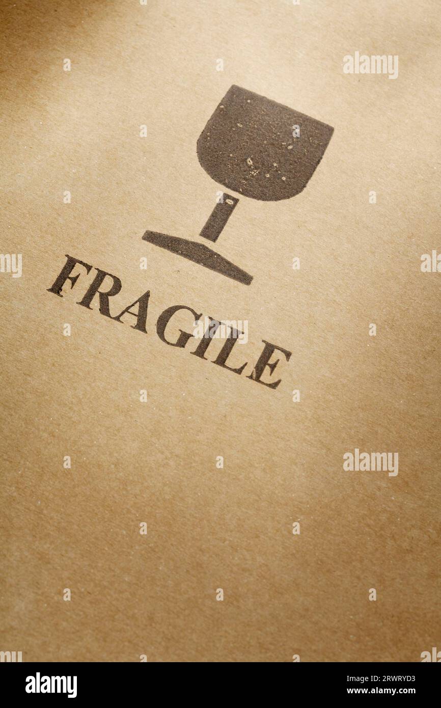 Fragile symbol printed on a cardboard box Stock Photo
