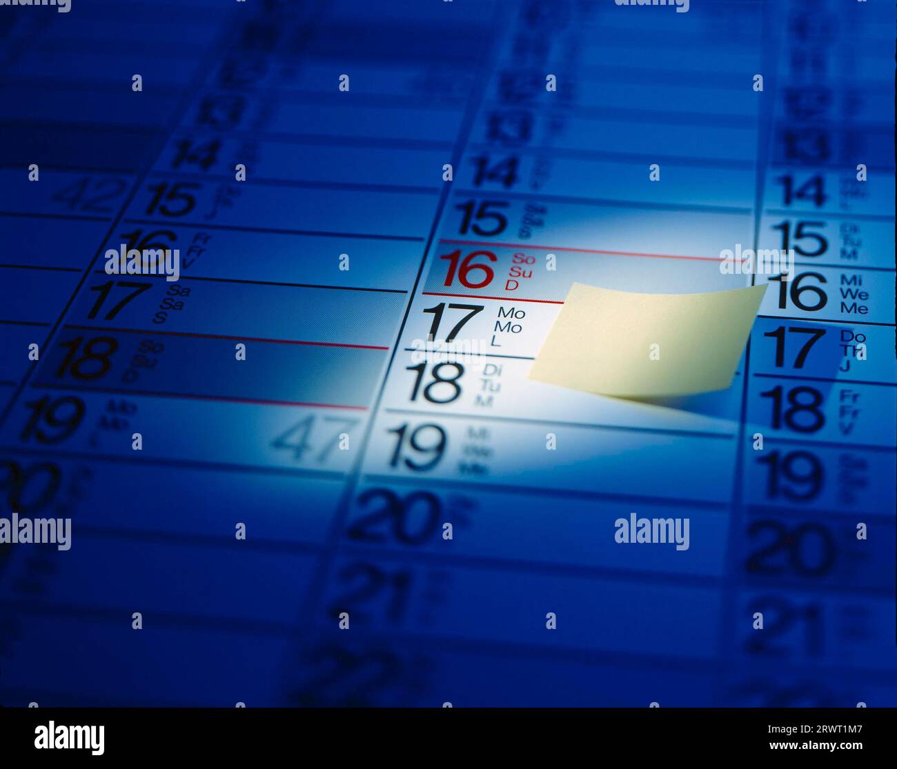 Detail from a calendar year planner with yellow post it sticker marker