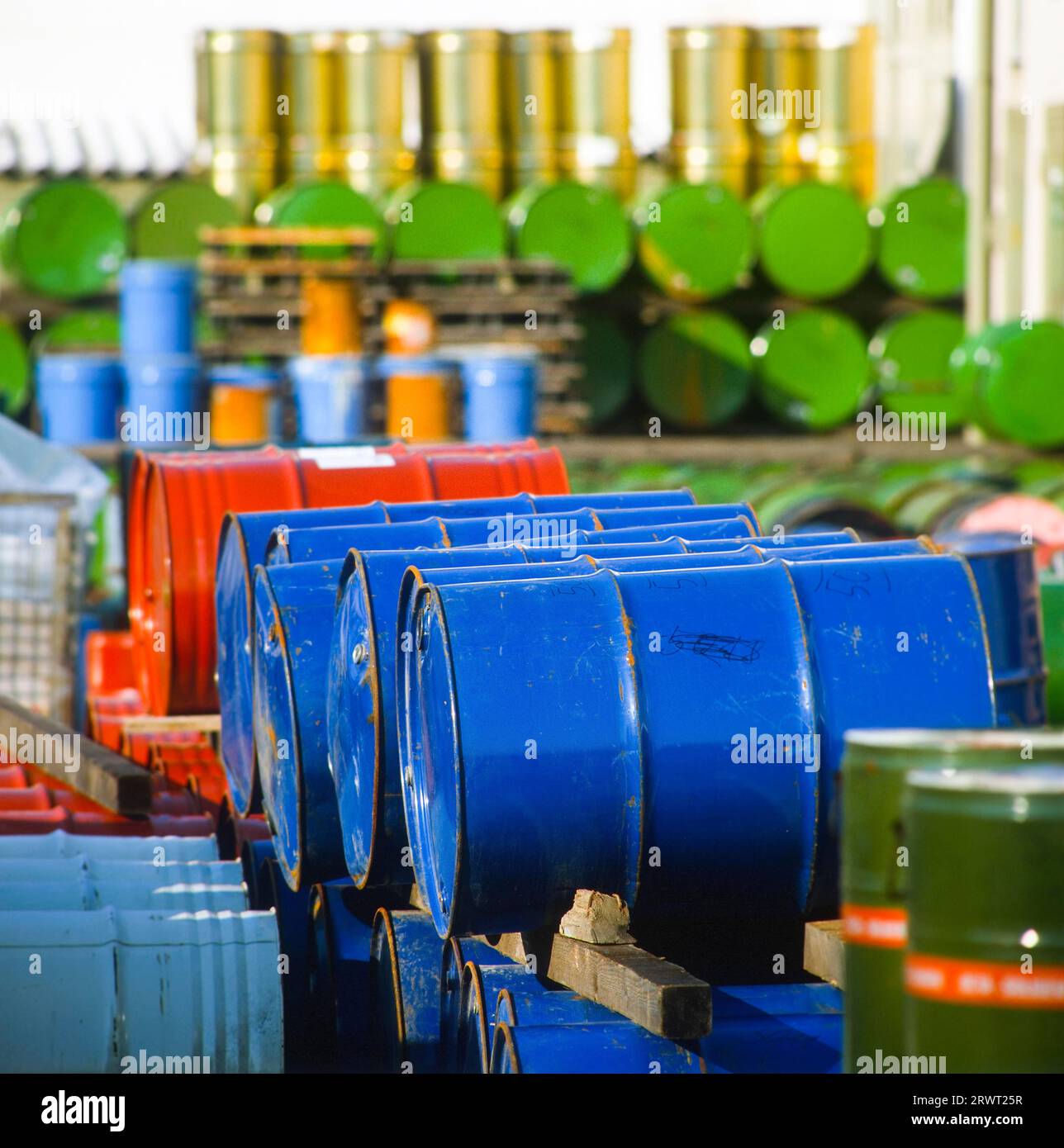 Chemical drums stacked high Stock Photo Alamy