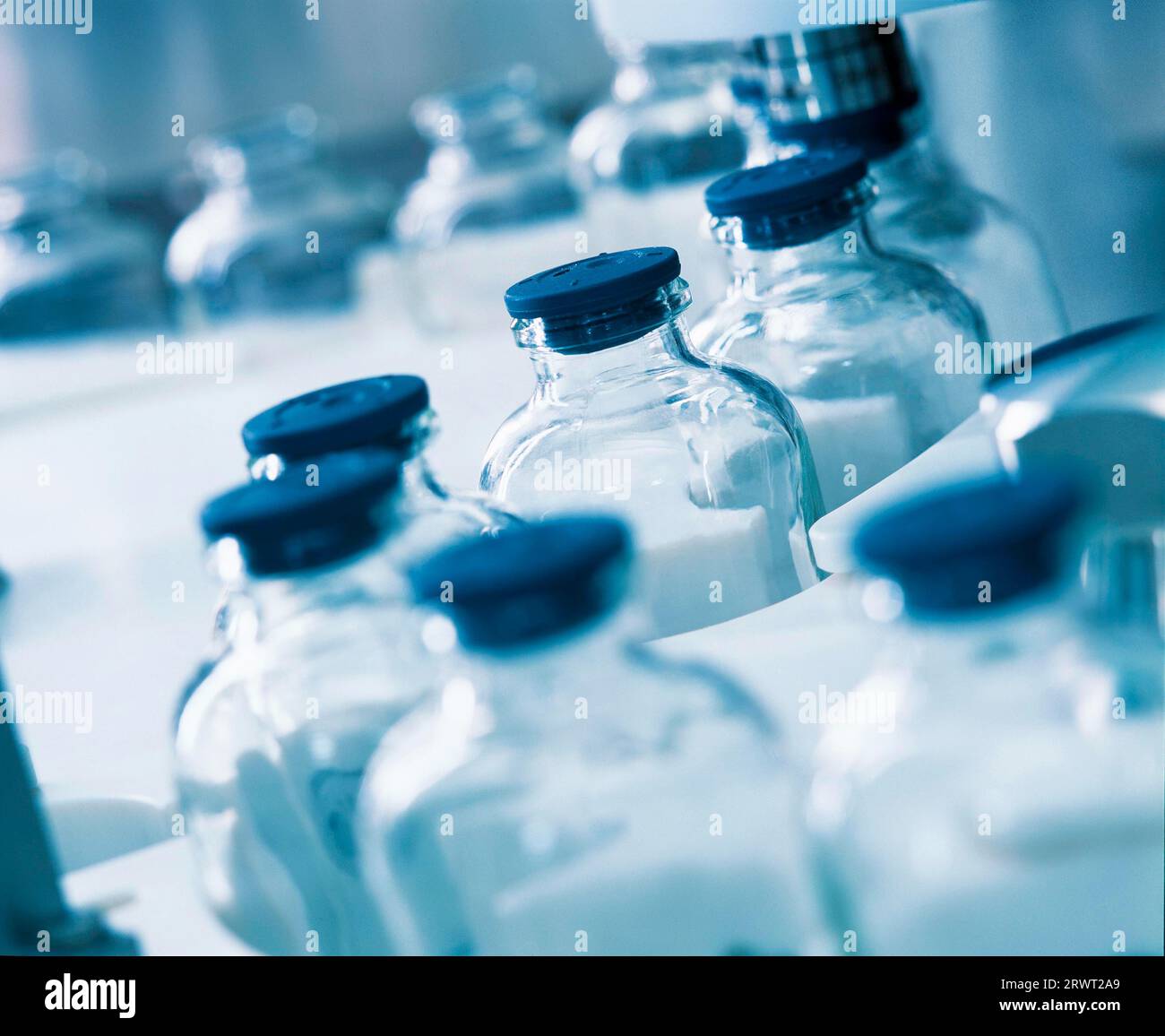 Medicine bottles, vials, in the filling machine Stock Photo