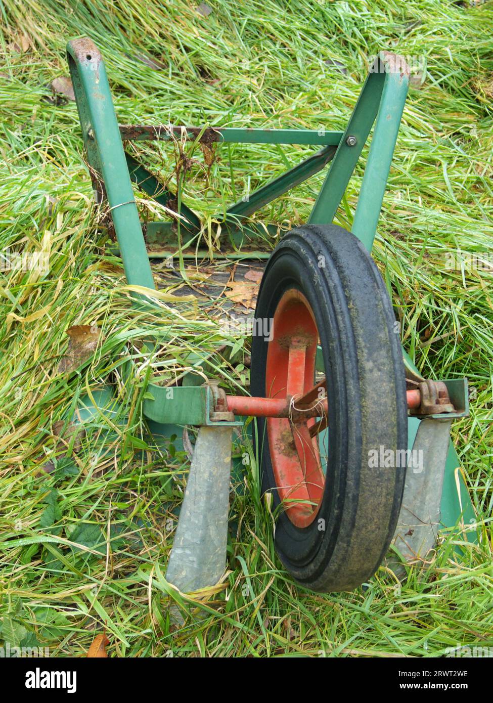 Wheelbarrow in the green Stock Photo