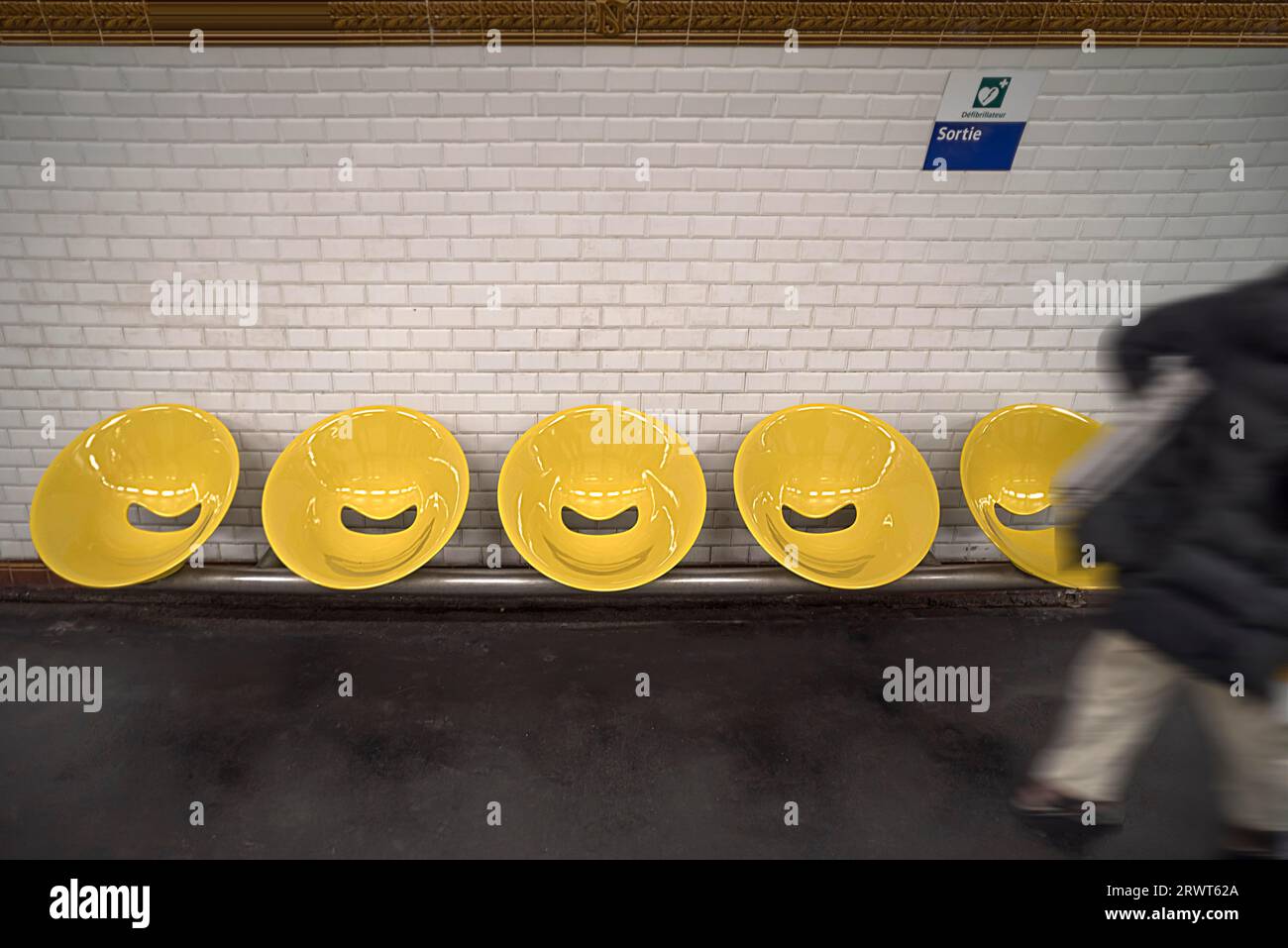Yellow bucket seats in a Métro station, Paris, France, Europe Stock Photo