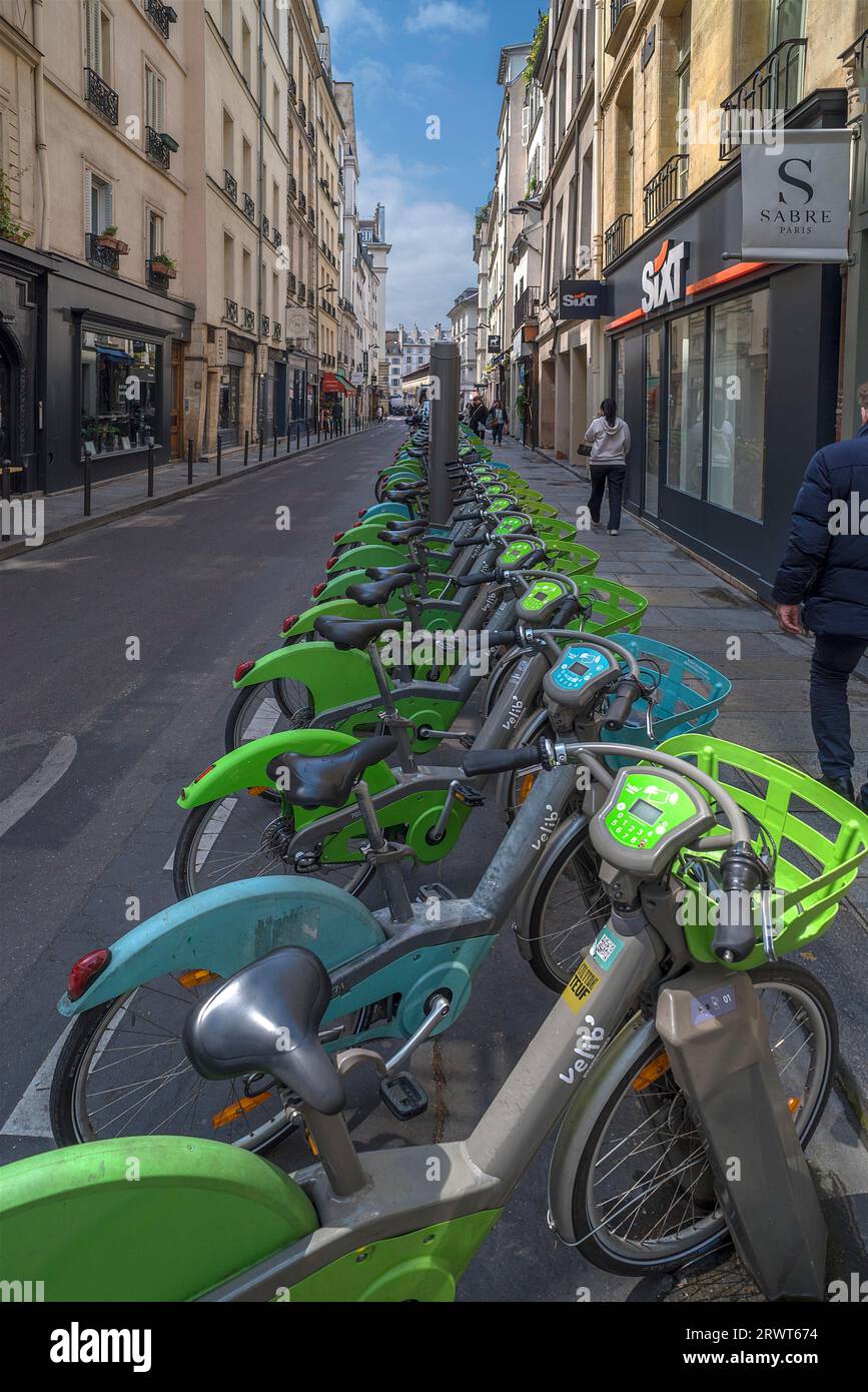 Urban rental bikes available in a street, Paris, France, Europe Stock
