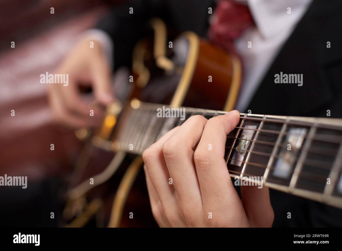 Jazz guitarist playing a chord Stock Photo
