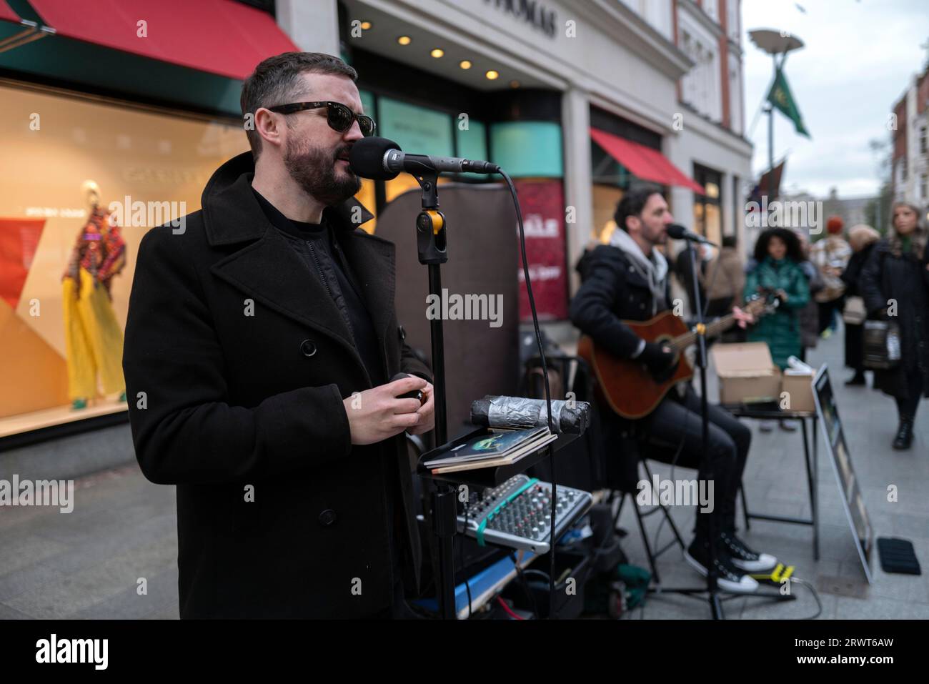 Andrew Kavanagh and Andrew Glover of the Irish rock group Keywest busking in Grafton Street. Dublin, Ireland, Europe Stock Photo