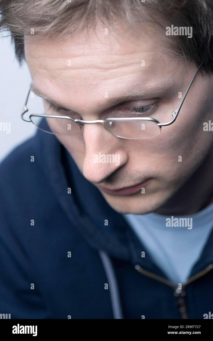 A man looks dejected, thoughtful A man looks dejected, thoughtful Stock Photo