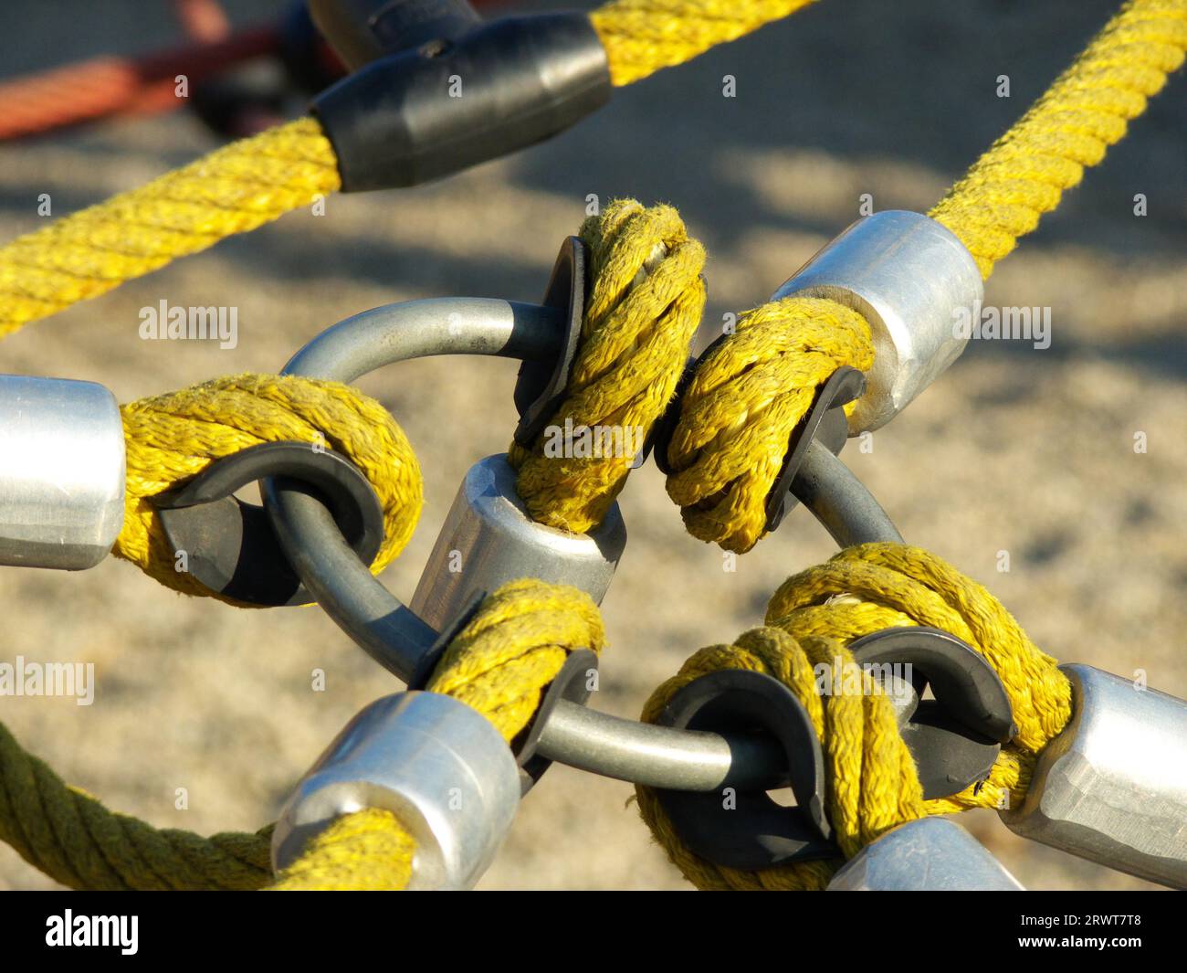 Circular connection of six yellow thick twisted ropes (ropes Stock