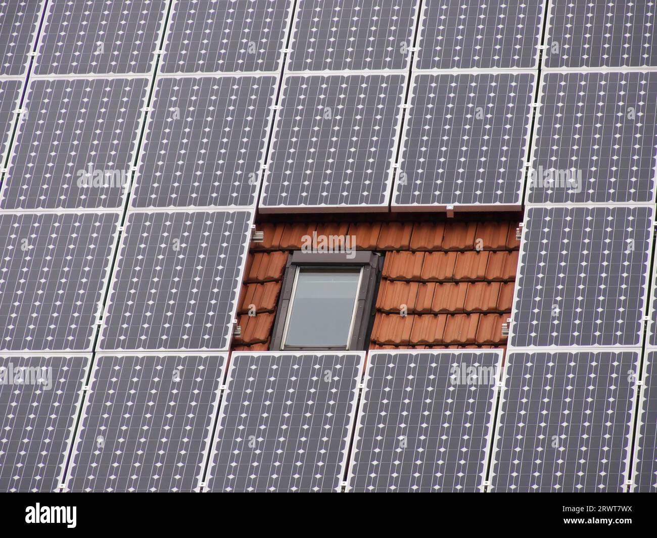 Solar roof with a difference, recess with roof hatch and red clay tiles ...