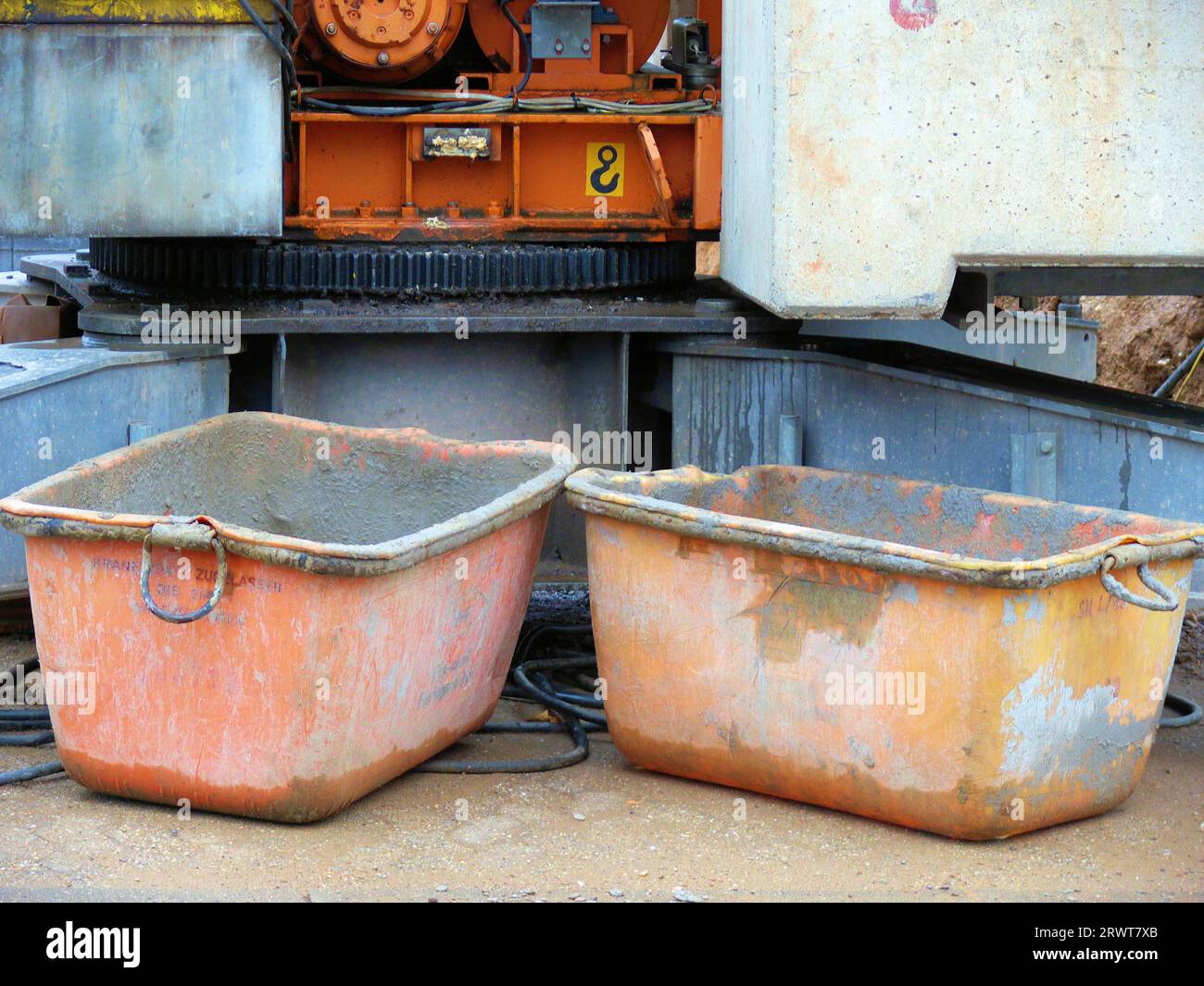 Two concrete tubs in front of construction crane Stock Photo Alamy