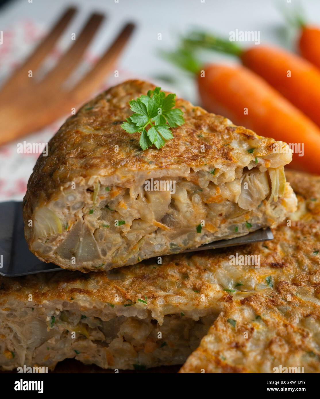 Spanish omelet made with rice and carrot and artichokes Stock Photo Alamy