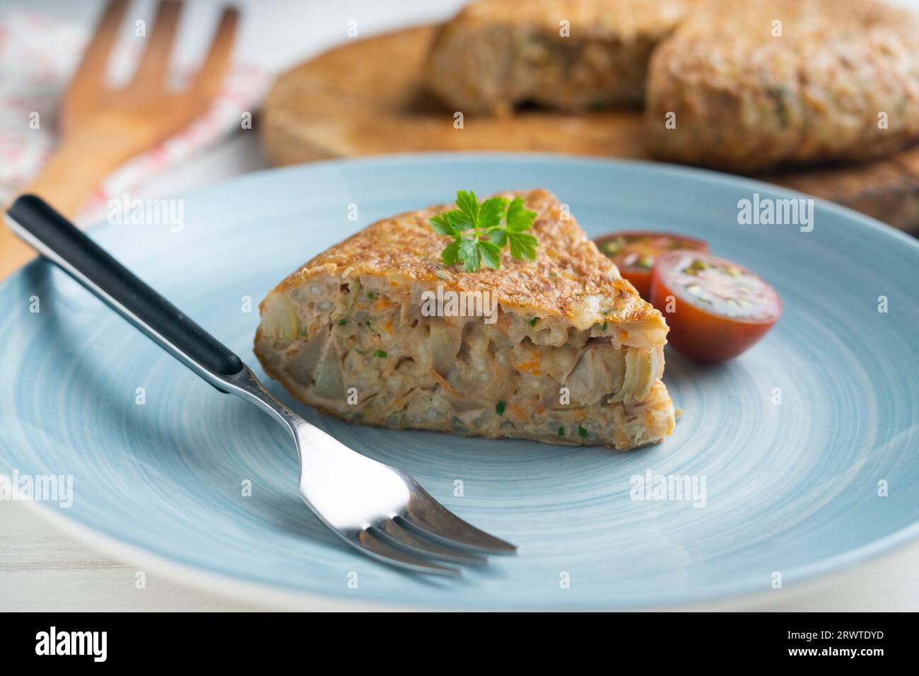 Spanish omelet made with rice and carrot and artichokes Stock Photo