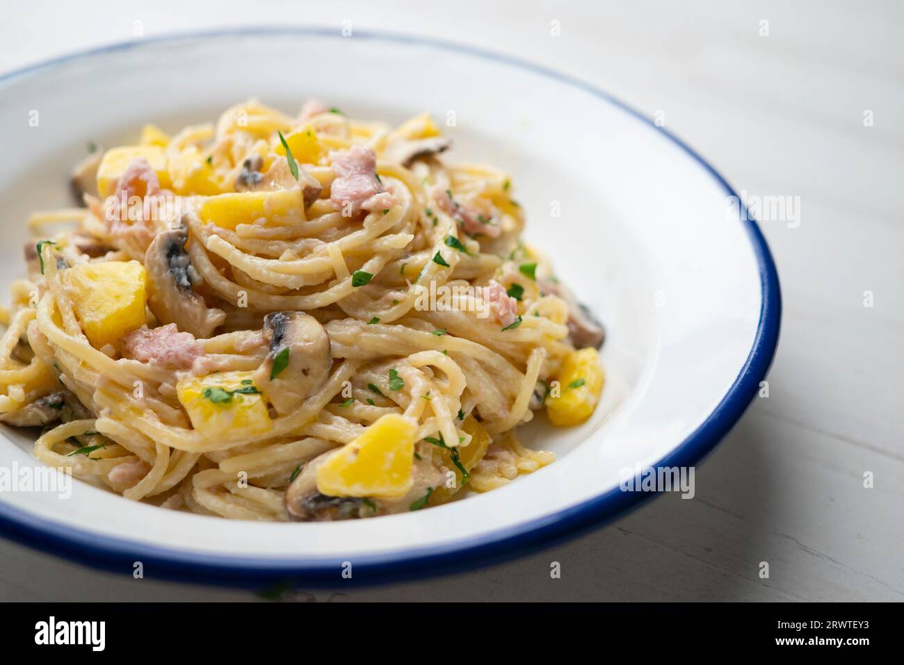 Spaghetti with carbonara sauce, ham and pineapple Stock Photo - Alamy
