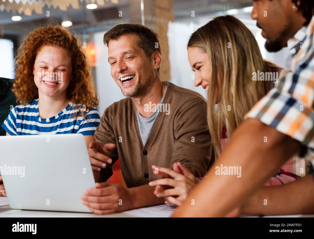 Programmers working in a software developing company office Stock Photo