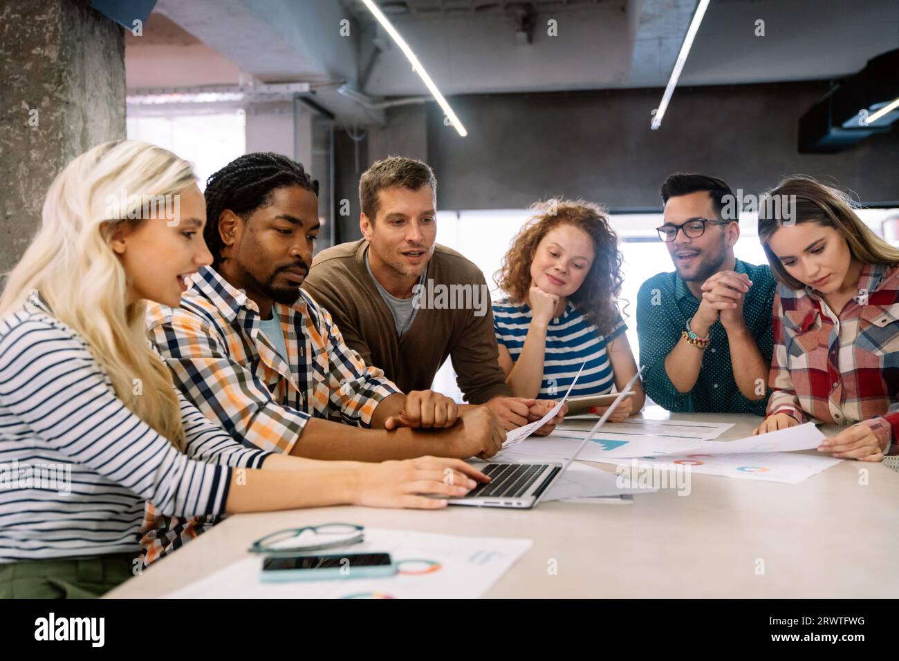 Business solutions, technology and strategy concept. Colleagues working and brainstorming in office Stock Photo