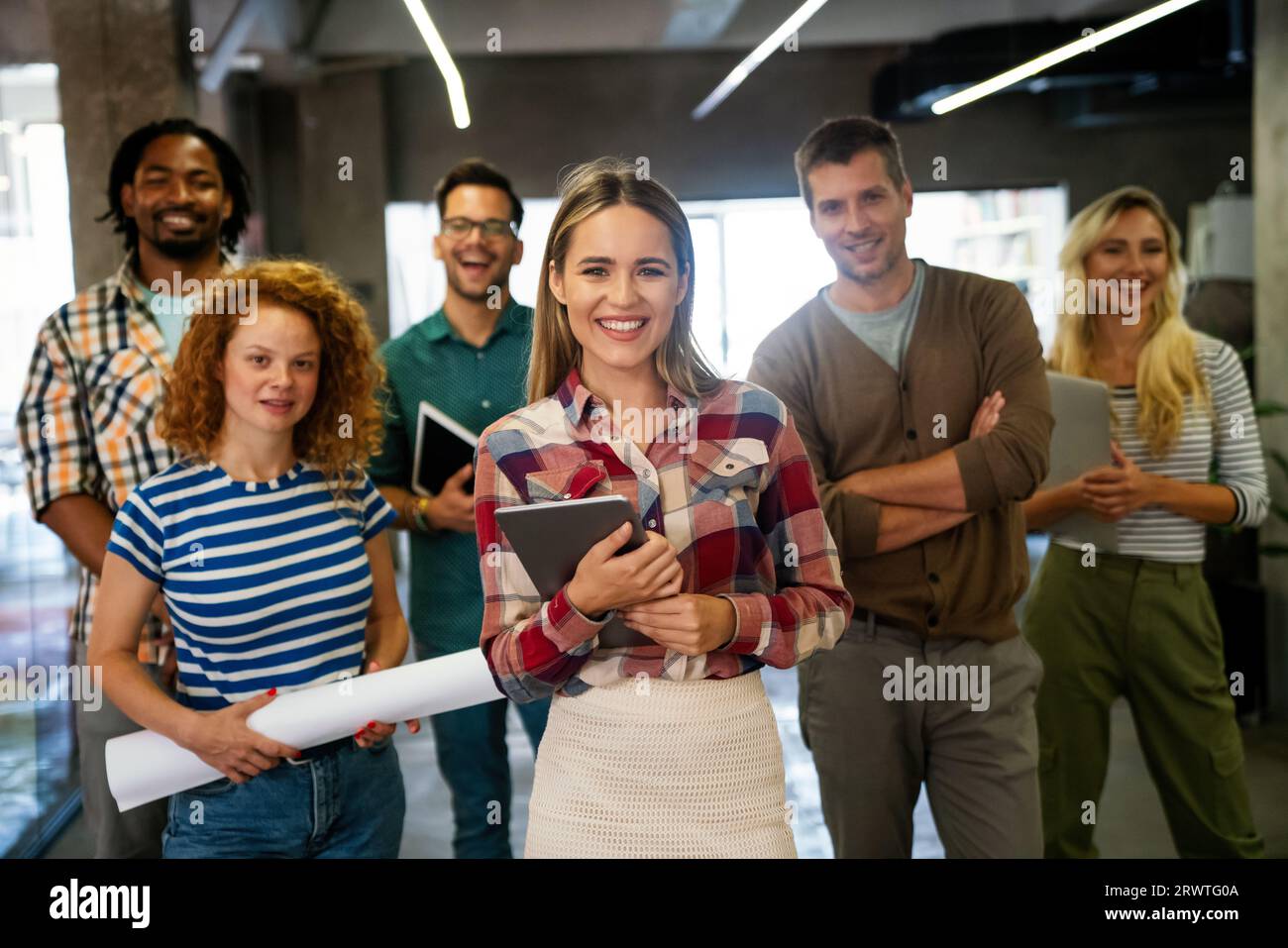 Group of successful happy multiethnic business people working as a team in office on meeting. Stock Photo