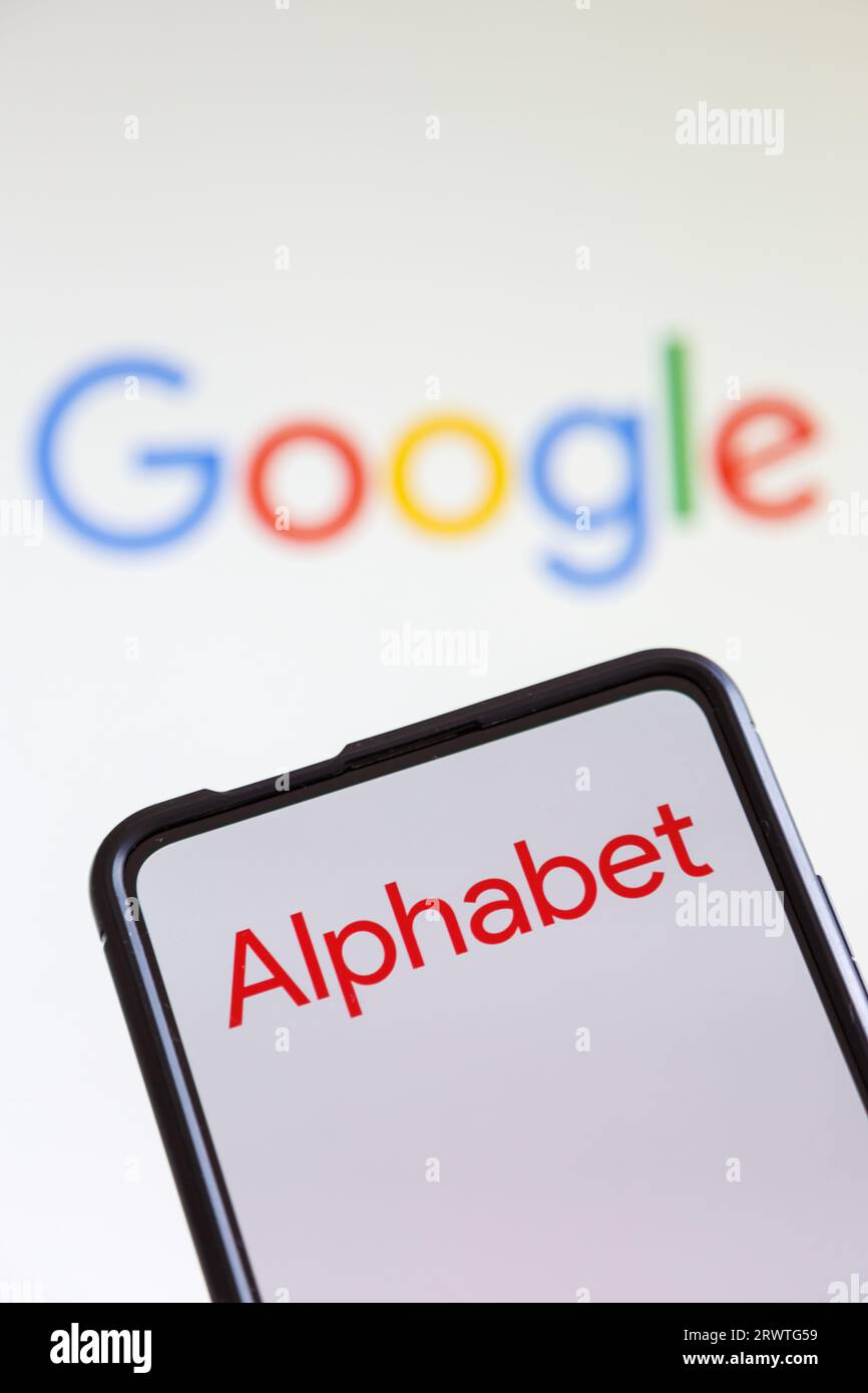 Stuttgart, Germany - July 20, 2023: Google and Alphabet logo of the computer hardware software manufacturer on a mobile phone and screen in Stuttgart, Stock Photo