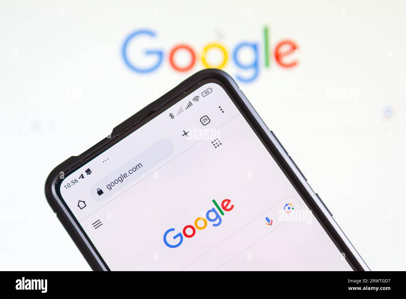 Stuttgart, Germany - July 20, 2023: Google logo of the computer hardware software manufacturer on a mobile phone and screen in Stuttgart, Germany. Stock Photo
