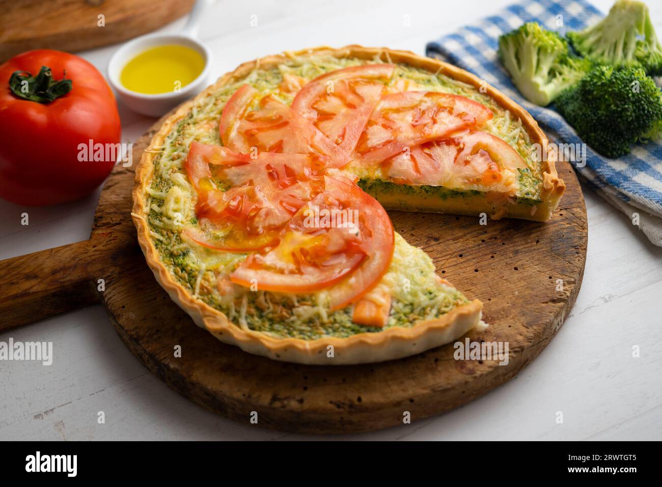 French style quiche with broccoli, salmon, and slices tomato Stock