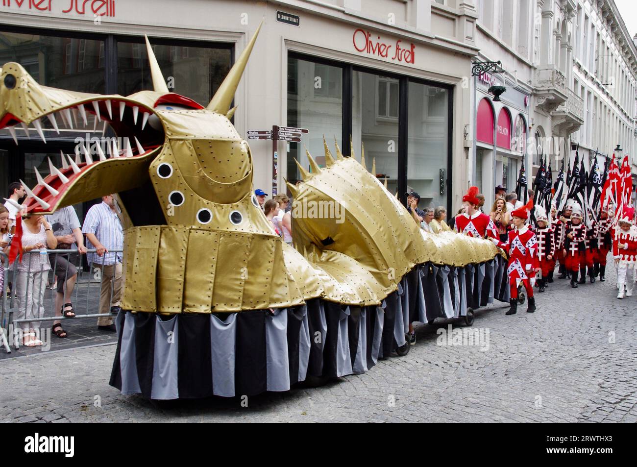 Marchers with a dragon in The 2012 Procession of the Golden Tree Pageant, held every 5 years since 1958. Bruges, Belgium Stock Photo