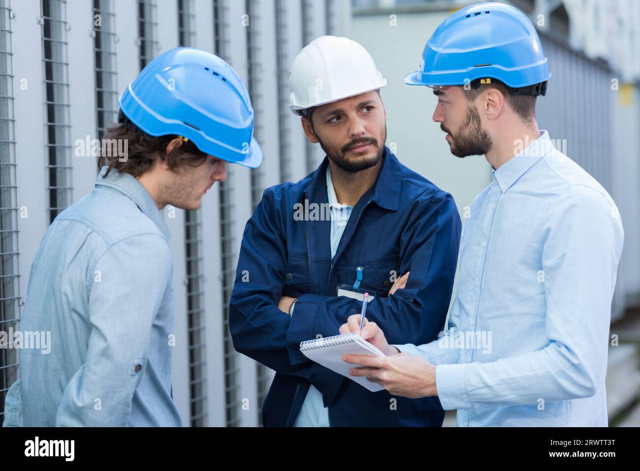 manager with engineers working outdoors Stock Photo