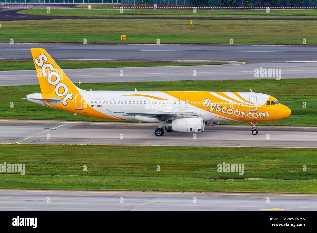 Changi, Singapore - February 3, 2023: Scoot Airbus A320 airplane at Changi Airport in Singapore. Stock Photo